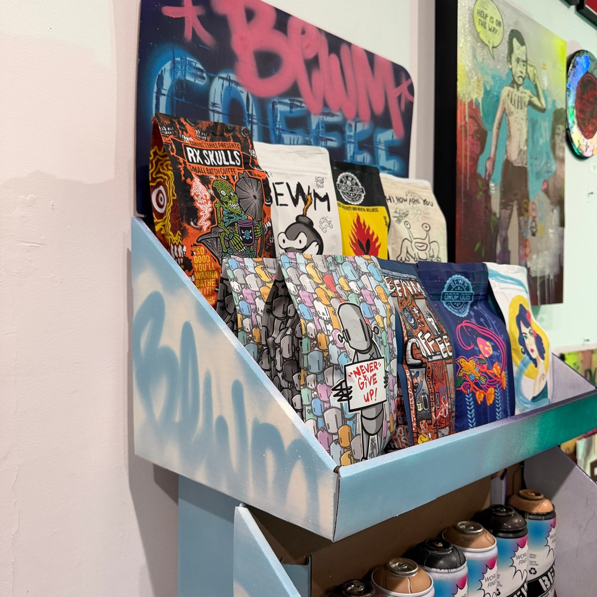 Artist-designed BEWM bags on a painted display at HOPE Outdoor Gallery